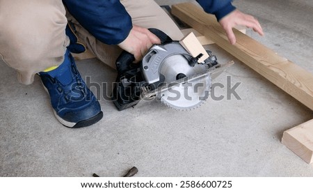Illegal use of circular saw. 
Blocking safety blade guard.