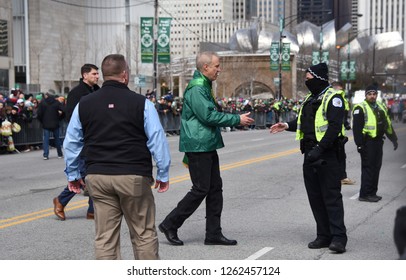 Illinois Governor Bruce Rauner Shaking A Chicago Police Officer's Hand During The Chicago Saint Patrick's Day Parade, Chicago, IL March 17, 2018