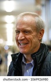 Illinois Republican Governor Bruce Rauner Talks With With Tim Cook, Chief Executive Officer Of Apple Inc., At Lane Technical College Prep High School In Chicago, Illinois, U.S., March 27, 2018.