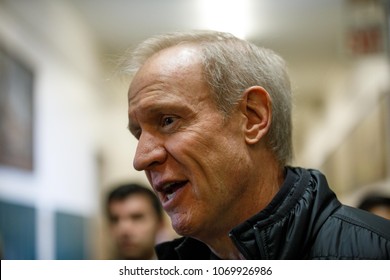 Illinois Republican Governor Bruce Rauner Talks With With Tim Cook, Chief Executive Officer Of Apple Inc., At Lane Technical College Prep High School In Chicago, Illinois, U.S., March 27, 2018.