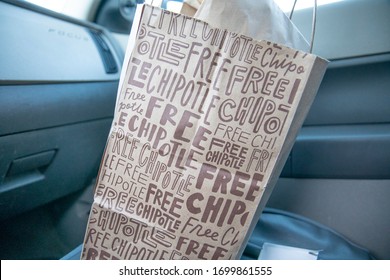 Illinois, United States, - April 2020: A Local Chipotle Is Open For Mobile Order Pickups. Accommodating Customers With Mobile Orders And Partneting With Delivery Services Like Uber Eats And Door Dash.