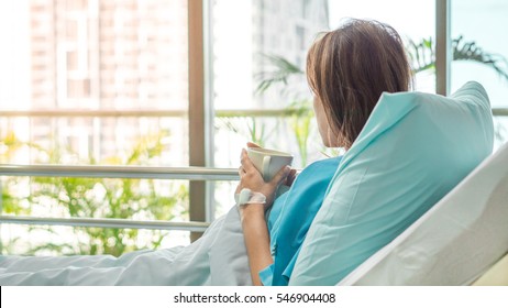 Illness Asia Patient Women And Hospital Concept - Illness Asian Patient Women On Bed Seeing Windows In Room Alone Of Hospital And Copyspace