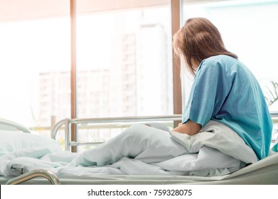 Illness Asia Patient Women And Hospital Concept - Illness Asian Patient Women On Bed Seeing Windows In Room Alone Of Hospital And Copyspace