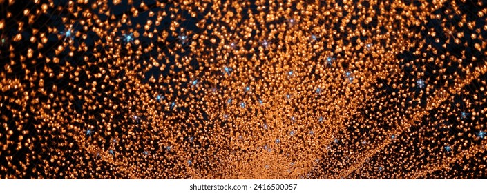 illuminate lights at night, featuring glowing flower lights with a gradual turn, creating a vibrant bokeh effect. A festive and decorative nighttime celebration in the urban cityscape night exture