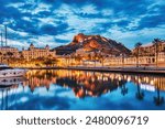 Illuminated Alicante Old Town Panorama at Dusk with Santa Barbara Castle and Harbor, Spain 