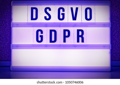 Illuminated board with the inscription DSGVO and GDPR ( Datenschutzgrundverordnung ) purple in English GDPR (General Data Protection Regulation) Introduction of the data protection directive in the EU