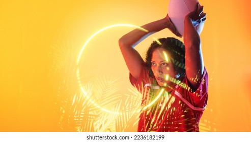 Illuminated circle and plants over biracial female rugby player throwing ball on yellow background. Copy space, composite, sport, competition, shape, nature, playing, match and abstract concept. - Powered by Shutterstock