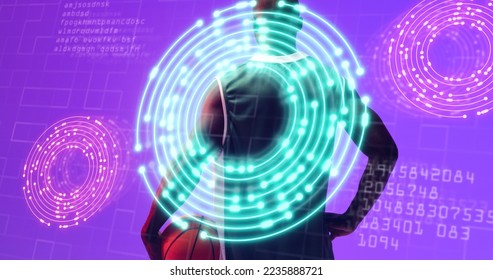 Illuminated circles and codes over african american basketball player on purple background. Composite, number, computer language, sport, competition, illustration, shape and abstract concept. - Powered by Shutterstock