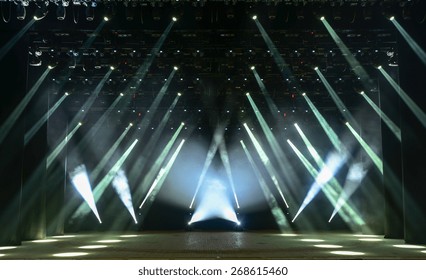 Illuminated Empty Concert Stage With Smoke And Rays Of Light