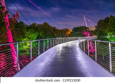 The illuminated Falls Park Liberty Bridge in Downtown Greenville South Carolina SC.