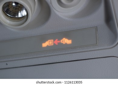 Illuminated Fasten Seatbelt In a Commercial Airplane Before Take