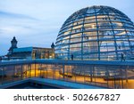 Illuminated glass dome on the roof of the Reichstag in Berlin in the late evening.