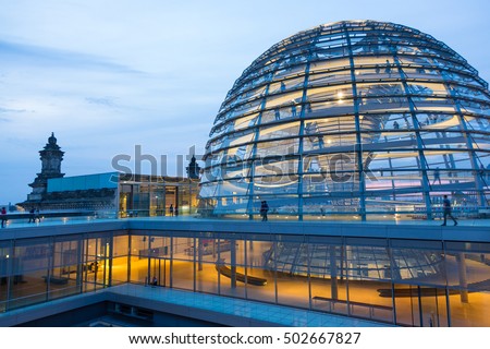 Illuminated glass dome on the roof of the Reichstag in Berlin in the late evening.