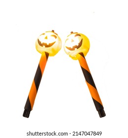 Illuminated And Glowing Two Halloween Stake Lights With Solar Powered Jack O Lantern Head Isolated On White Background. Spooky Garden Lights Outdoor For Path Walkway Light Landscaping.