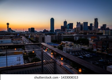 Illuminated Light Bulbs Light The Way In The Big City With Golden Hour Sunset Over Dallas Texas USA Skyline Cityscape Sunset City Lights Glowing As The Sun Sets Behind The Horizon