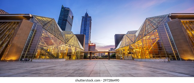 Illuminated Modern Building Exterior And  Empty Street