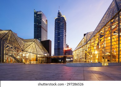 Illuminated Modern Building Exterior And  Empty Street