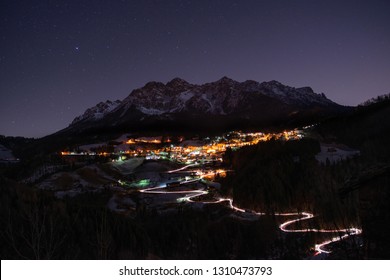 Illuminated Mountain Village At Night