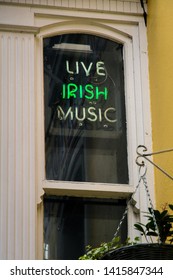 illuminated neon sign for irish live music in dublin temple bar destrict - symbol for irish pubs
