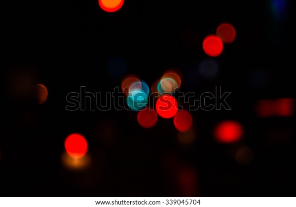 Illuminated night road,\
unfocused