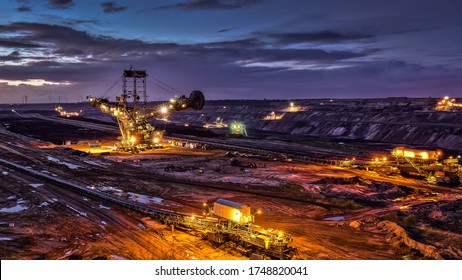 Illuminated Night Shot of Open Surface Coal Mining Garzweiler Germany Purple Colors Dramatic Sky