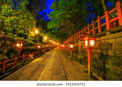 Illuminated path at night from the red lanterns leading from Yasaka Shrine to the Gion weeping cherry tree in Maruyama Park. Gion Shrine is one of the most famous shrines in Kyoto, Japan .
