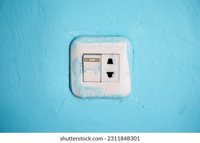 The illuminated power outlet serves as a convenient and reliable source of electrical energy, seamlessly connecting light fixtures to the grid - Shutterstock ID 2311848301