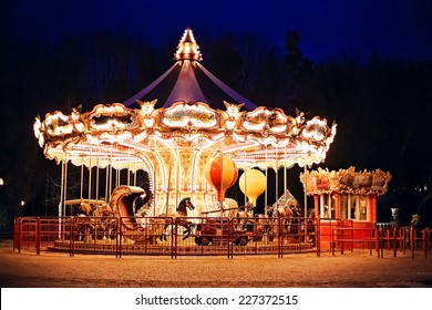 illuminated retro carousel at night