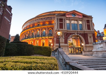 Illuminated The Royal Albert Hall in London at dusk