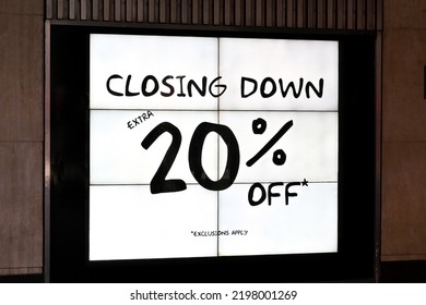 Illuminated Sign Outside A Retail Store Adverrtising A Closing Down Sale. No People.