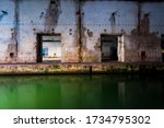 Illuminated submarine base of Saint-Nazaire at night, France. Travel destinations, sightseeing, history, World War II theme