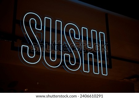 Illuminated Sushi sign at food outlet. neon food sign for Japanese cuisine 