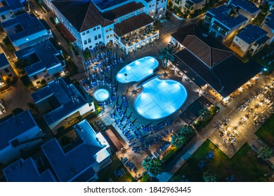 Illuminated Swimming Pool At Night, Aerial Top View. Rest And Relax Concept