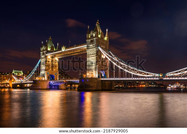 Illuminated Tower Bridge at\
night, water reflection, Southwark, London, England, United\
Kingdom