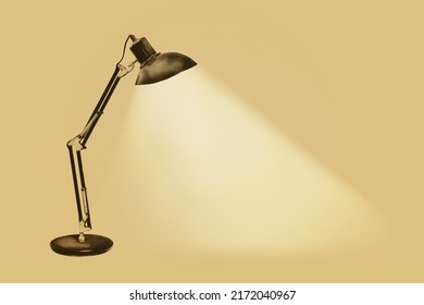 Illuminated vintage rusty desk lamp with flexible arms on a sepia background - Shutterstock ID 2172040967