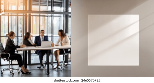 Illuminated wall with a blank squared sign in a blurred office with meeting. Copy space for text, ideal image for office workers concept. Soft focus. - Powered by Shutterstock