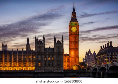 The illuminated Westminster Palace and Big Ben clock tower, major tourist attraction and Parliament in London just after sunset