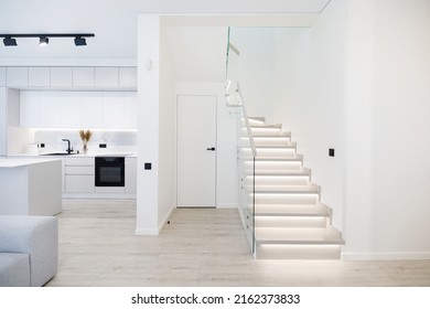 Illuminated Wooden Staircase In Duplex Apartment