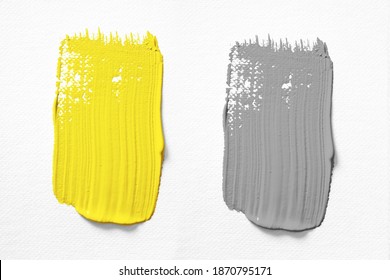 Illuminating and Ultimate gray Pantone color of the year 2021 oil paint stroke on white background
