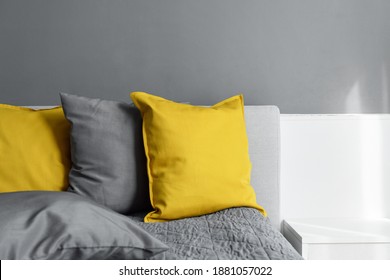 illuminating yellow ultimate gray colored pillows on bed Trendy 2021 colors years Modern interior design Cozy textile Sweet home