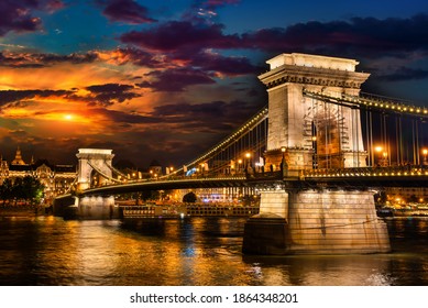 Illumination of Chain Bridge in Budapest at cloudy evening