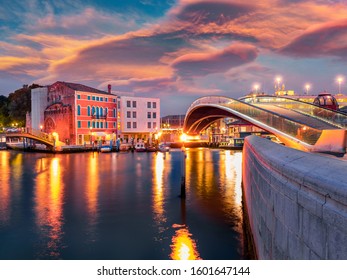 Illumitaned spring sunrise in Venice, Italy, Europe. Colorful morning view of Constitution Bridge. Magnificent Mediterranean seasacape. Traveling concept background.