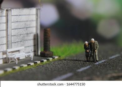 illustation photo for romantic memorable moment, Old Couple Mini figure Toy walking at pedestrian 
 - Shutterstock ID 1644775150