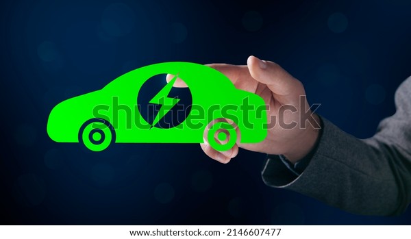 Illustrated\
green electric car. Man tapping on the\
screen
