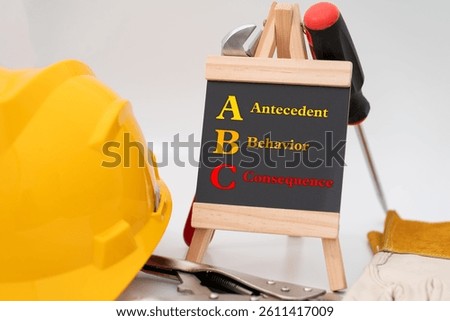 Illustration for Antecedent-Behavior-Consequence (ABC) model featuring safety helmet, screwdriver,  natural leather and suede leather hand glove, curved jaw lock pliers, and a Chalkboard with text ABC