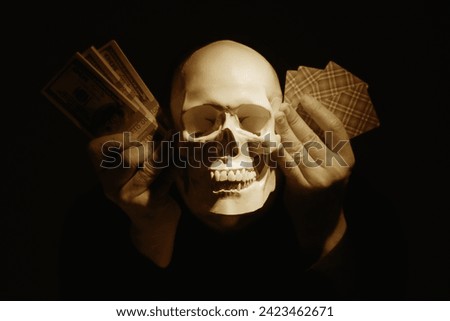 Illustration to Latin sentence: Thus passes the glory of the world (Sic transit gloria mundi). Skull with money and game cards against black background.  Stock photo © 