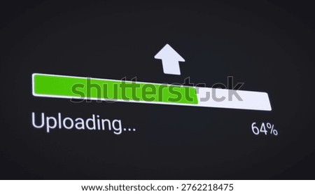 Illustration of the process of uploading file from the Internet on a computer monitor screen. A computer monitor displaying information about the data download in real time, including percentages.