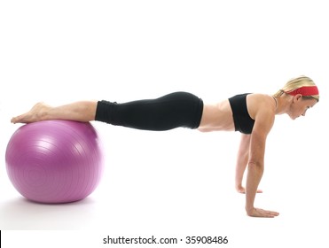 Illustration Of Push Ups On Fitness Core Training Ball With Push Up Bars By Attractive Middle Age Fitness Trainer Teacher Woman Exercising And Stretching