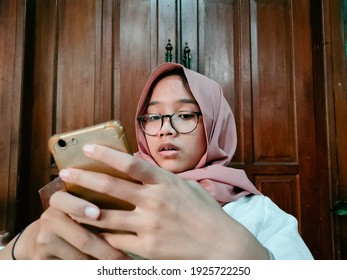 Illustration Of Someone Shocked To See Something On His Cellphone