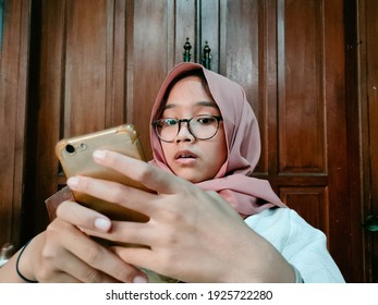 Illustration Of Someone Shocked To See Something On His Cellphone